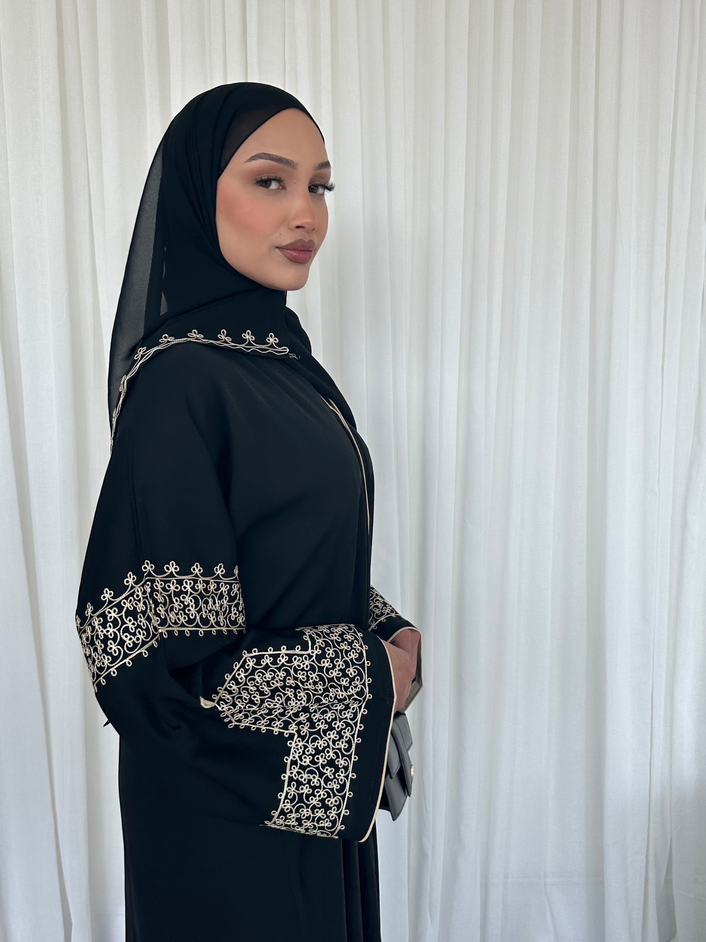 Layaan black embroidery buttoned abaya