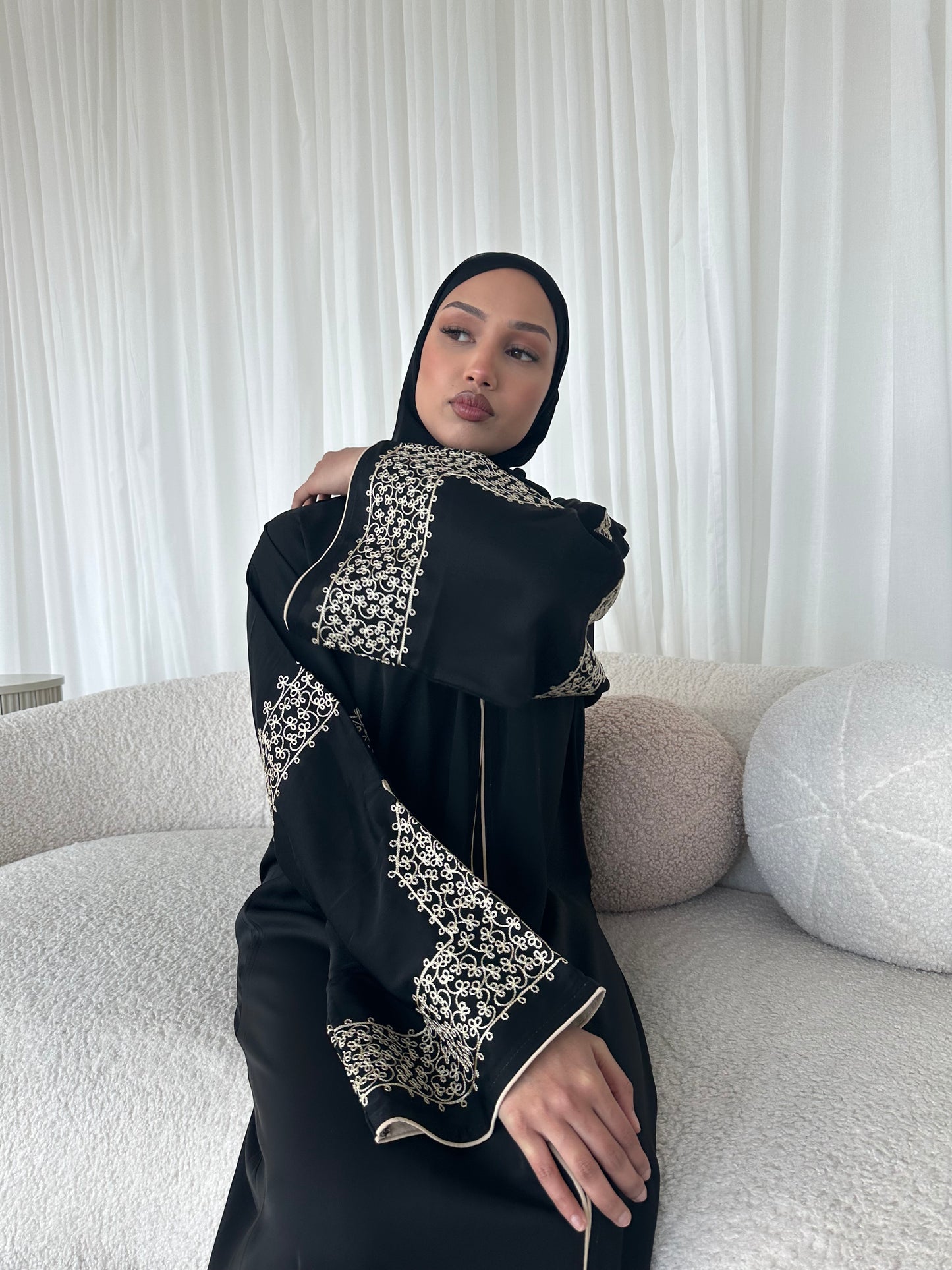 Layaan black embroidery buttoned abaya