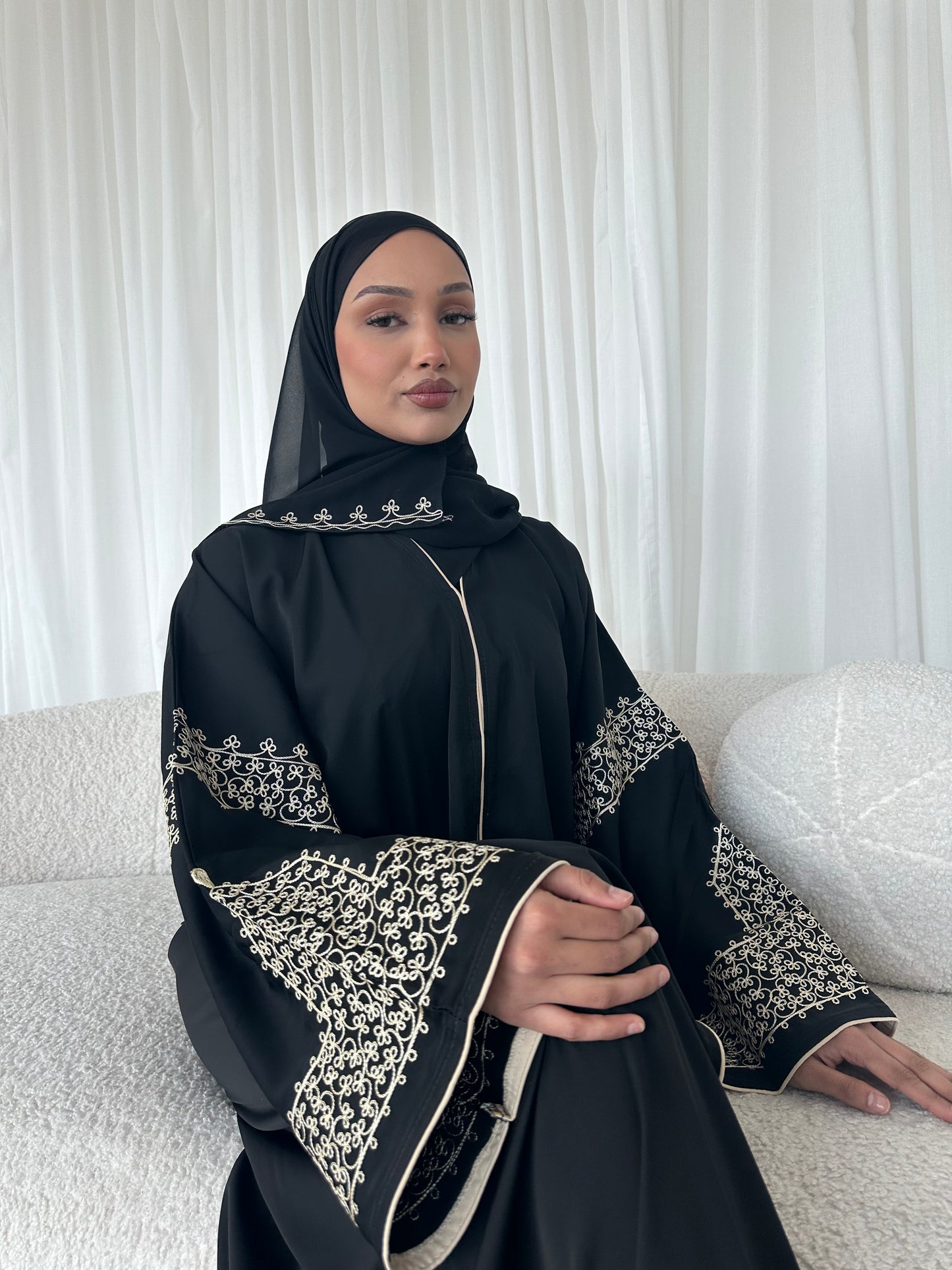 Layaan black embroidery buttoned abaya