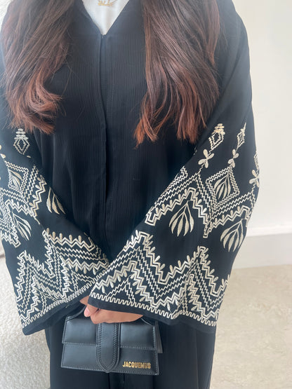 Sana 2.0 beige embroidery on black abaya with buttons
