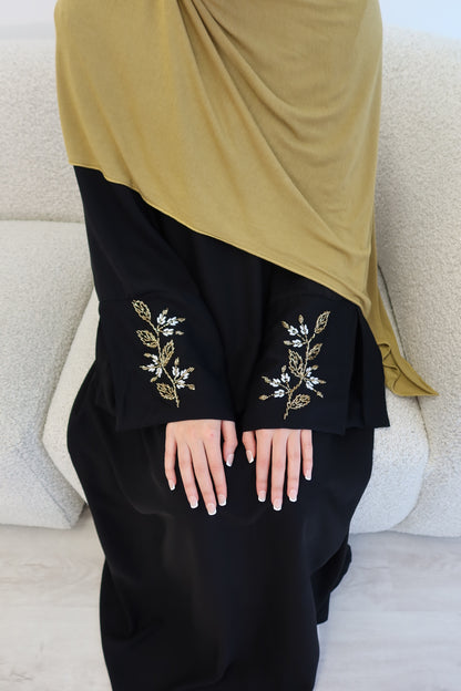 Samira black closed abaya with gold and white embellishments
