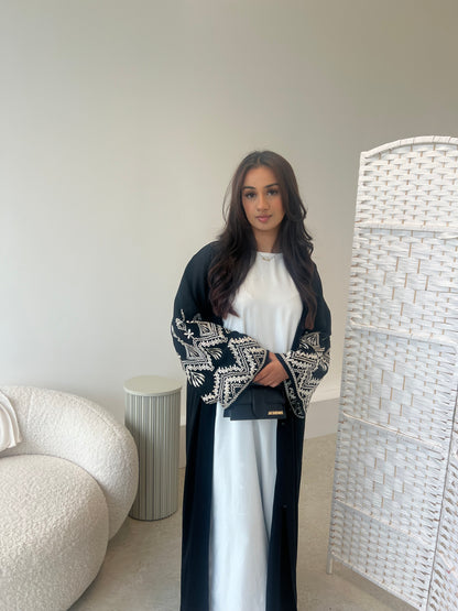 Sana 2.0 beige embroidery on black abaya with buttons