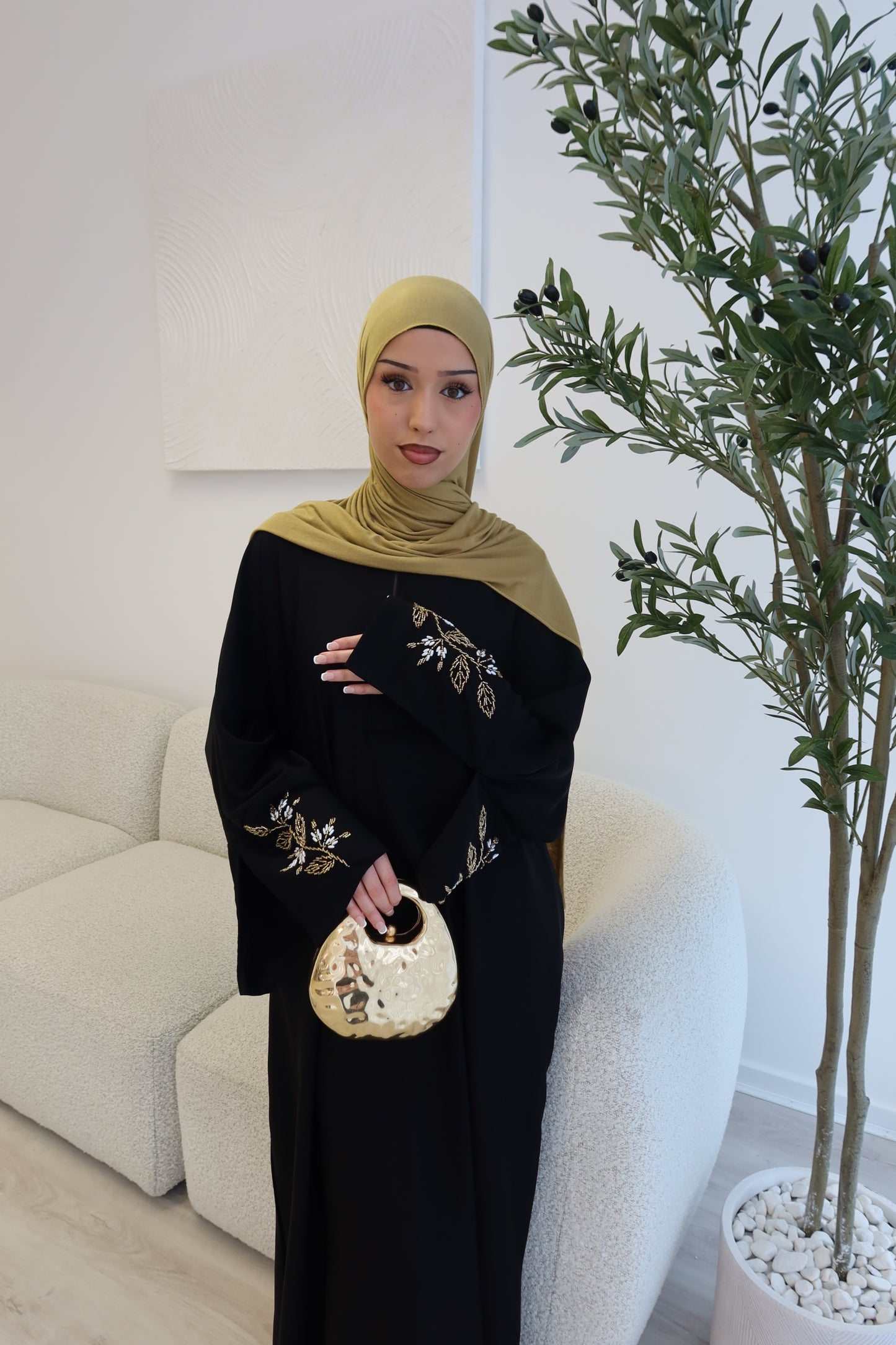 Samira black closed abaya with gold and white embellishments