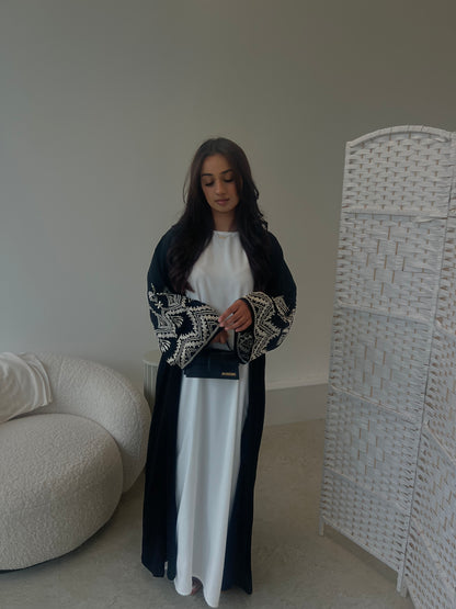 Sana 2.0 beige embroidery on black abaya with buttons
