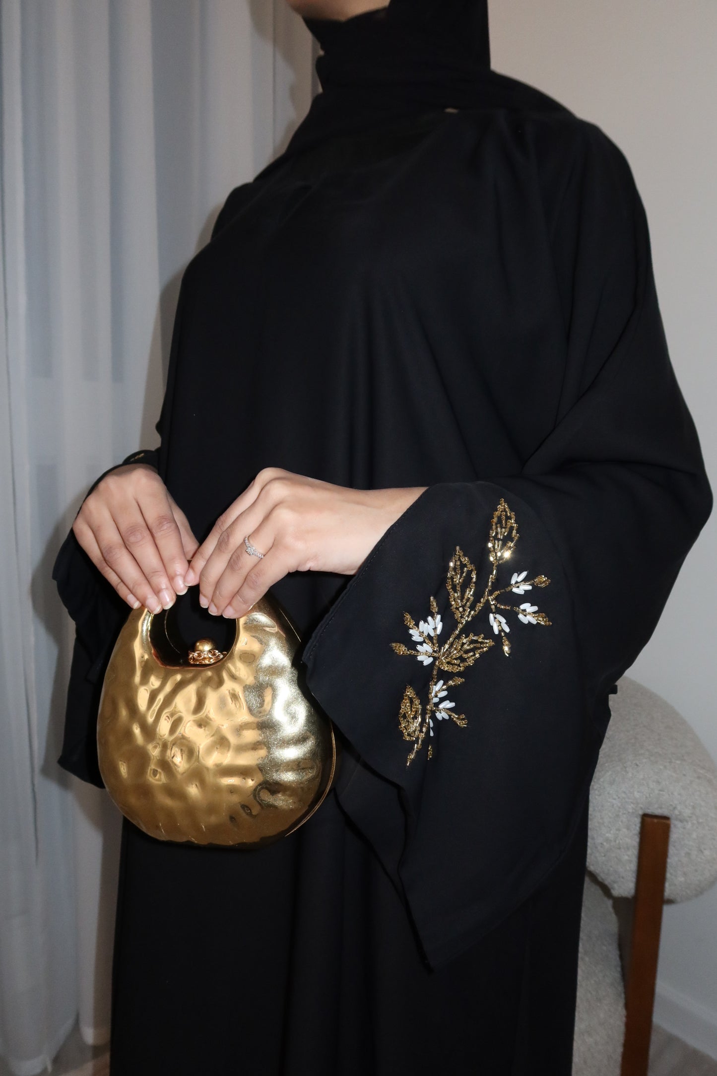 Samira black closed abaya with gold and white embellishments