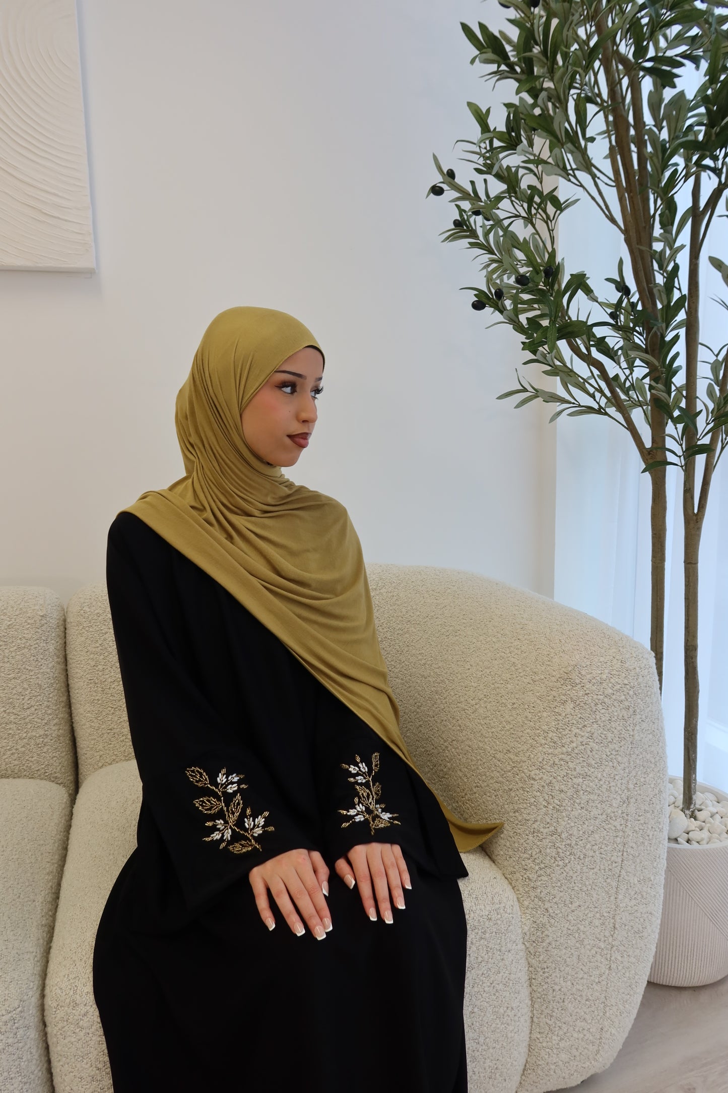 Samira black closed abaya with gold and white embellishments