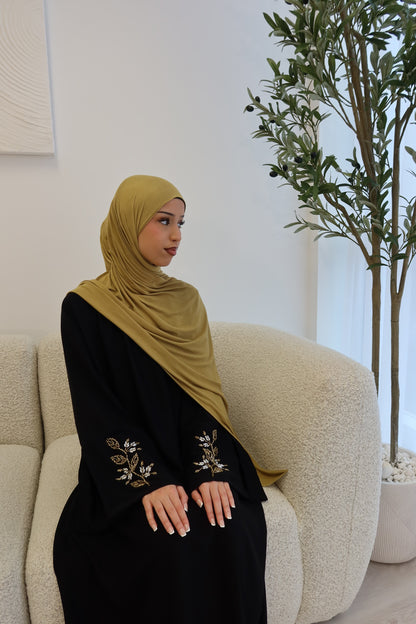 Samira black closed abaya with gold and white embellishments