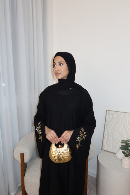 Samira black closed abaya with gold and white embellishments