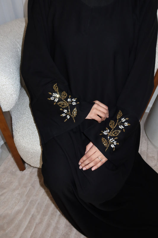 Samira black closed abaya with gold and white embellishments
