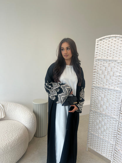Sana 2.0 beige embroidery on black abaya with buttons