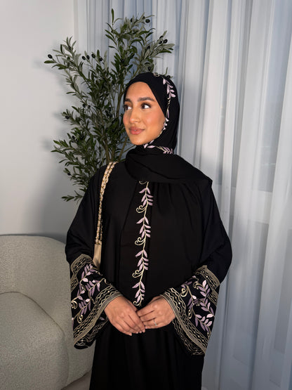 Nawara black abaya with pink embroidery and matching embroidery hijab