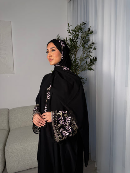 Nawara black abaya with pink embroidery and matching embroidery hijab