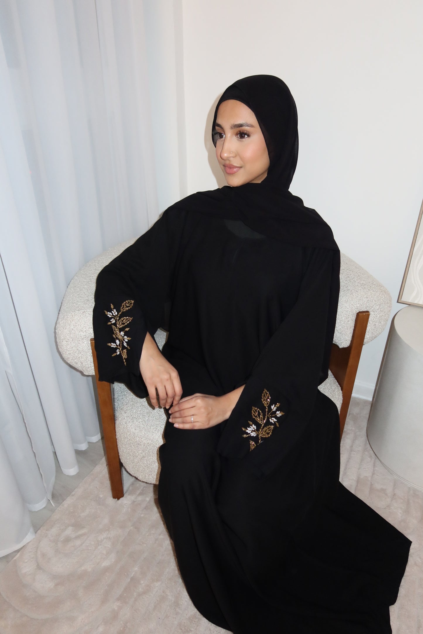 Samira black closed abaya with gold and white embellishments