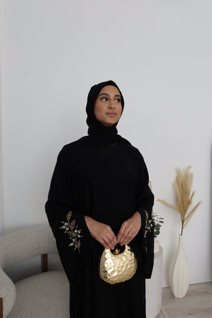 Samira black closed abaya with gold and white embellishments